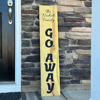 Osage orange entry sign with black lettering